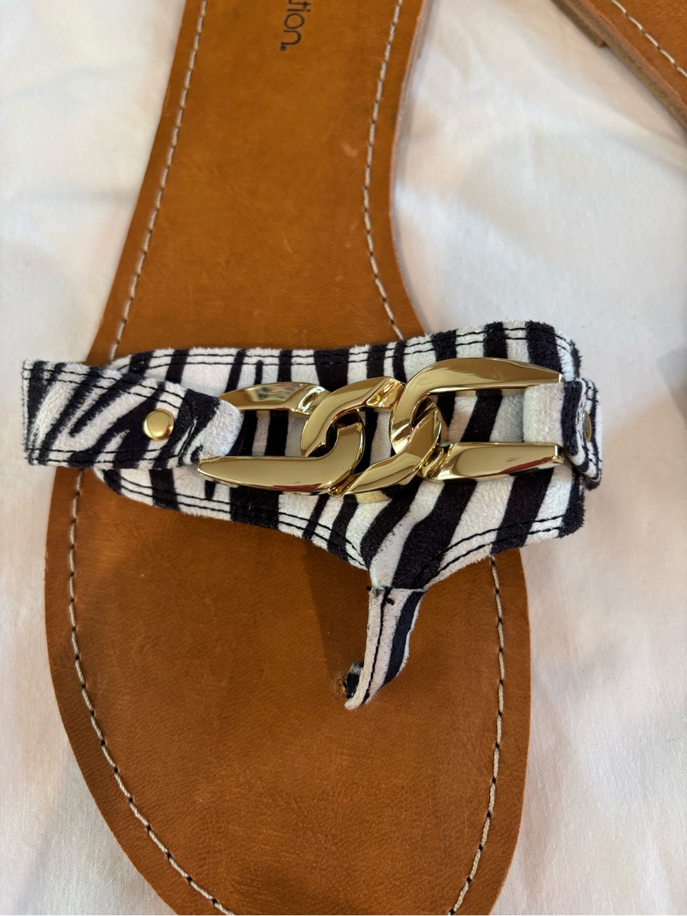 Women’s Black & White Zebra Print Thong Sandal with Gold Chain Accent